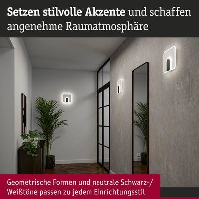 Moderne LED-Wandleuchten in geometrischem Design mit neutralen Schwarz-Weiß-Tönen im Flur mit Spiegel und Pflanzen