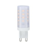 Petite lampe LED blanche avec culot G9 diffusant une lumière blanc chaud pour éclairage économique