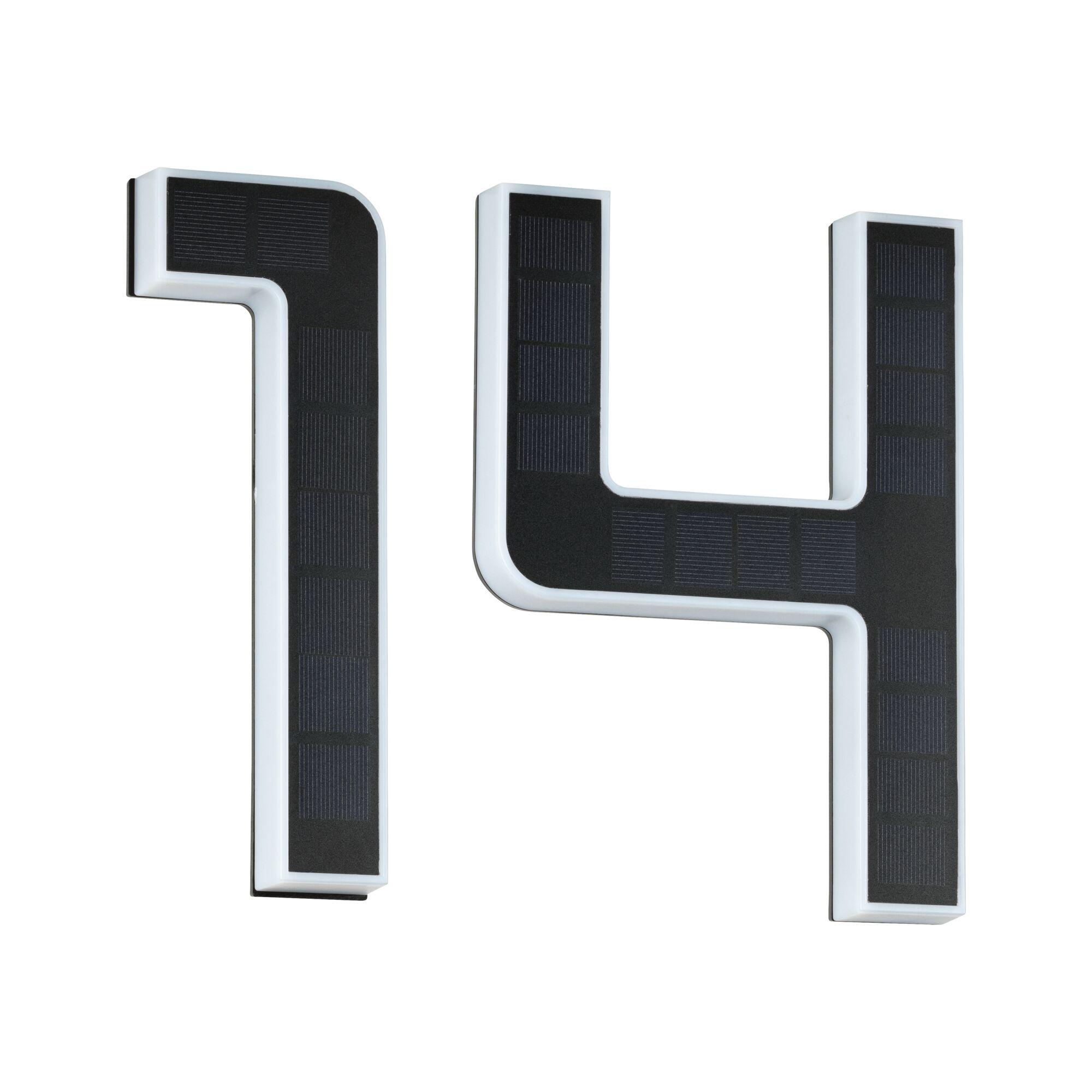 White LED letter with black solar panels for energy-efficient outdoor lighting