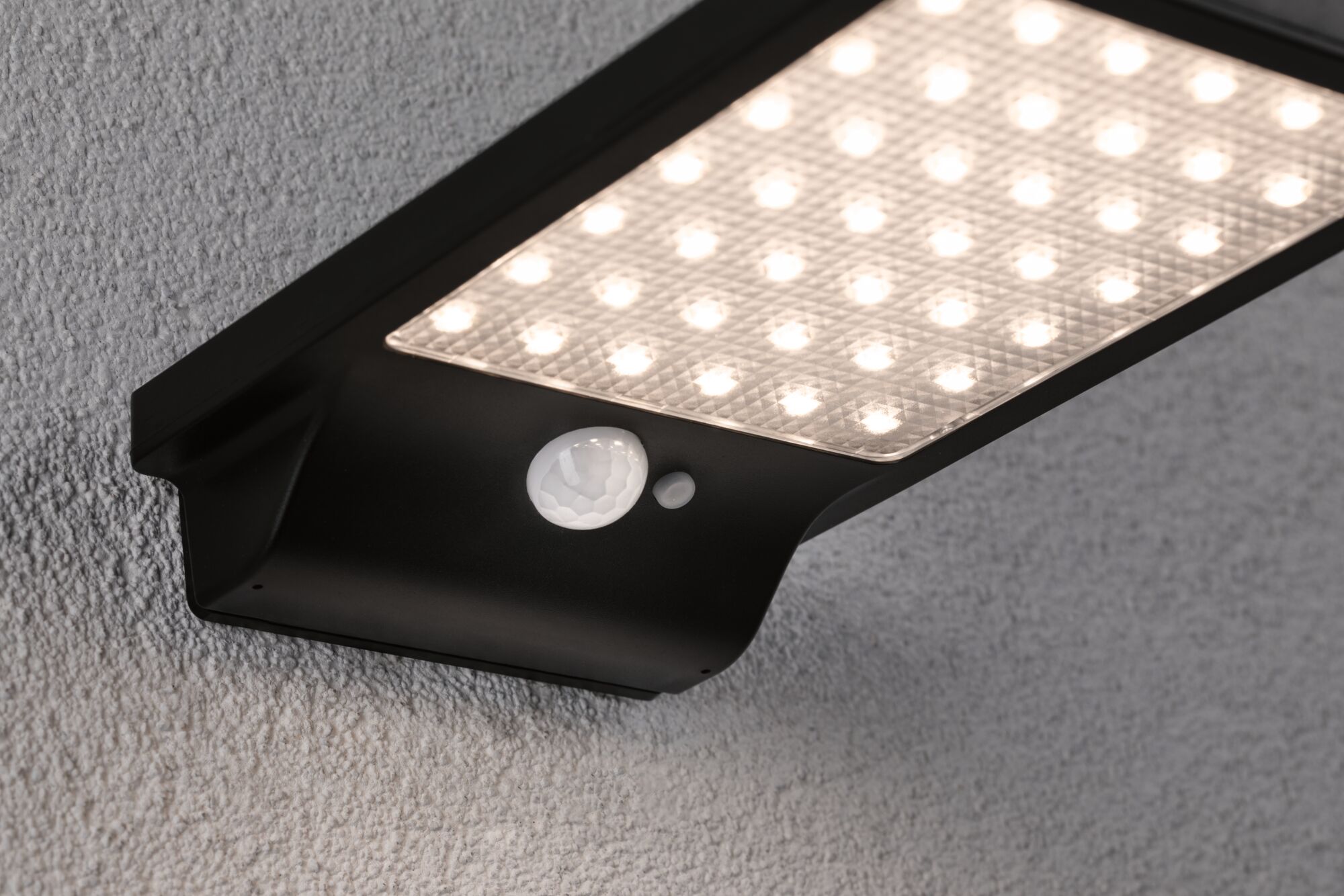 Black LED outdoor wall light with motion sensor and warm white light for home exterior lighting