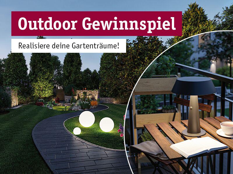 Outdoor-Gewinnspiel-Bild mit beleuchtetem Gartenweg und moderner Tischlampe auf Balkon für Gartenträume.
