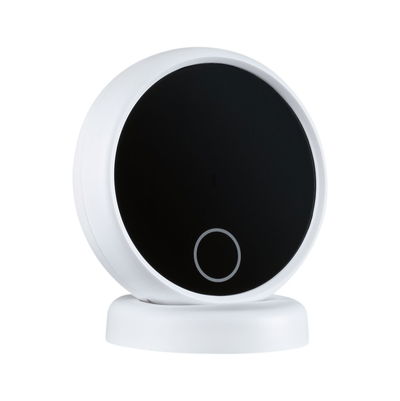 Round white smart home device with black touch surface and control ring for lighting