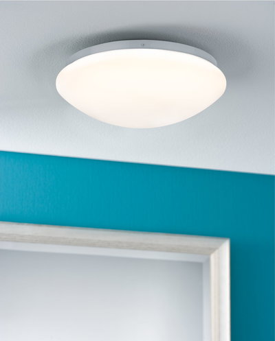 Round white plastic ceiling light with warm white illumination for modern living spaces
