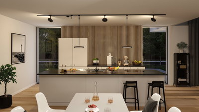 Modern kitchen with black countertop, white cabinets, and Paulmann LED track lighting system.