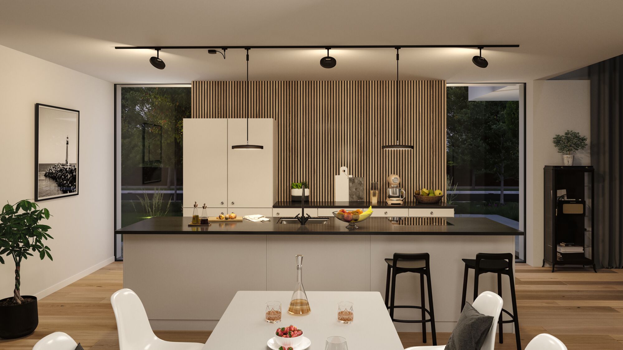 Moderne keuken met zwart aanrecht, witte kasten en Paulmann LED-railsverlichting.