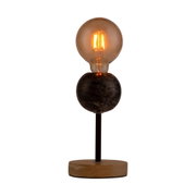Modern table lamp with wooden base, black metal rod, and warm glowing bulb for ambient home lighting