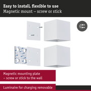 White magnetic mounting cube with screws and adhesive pad for flexible wall installation