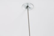 Ceiling with brushed aluminum suspension point and grey textile cable for modern LED lighting.