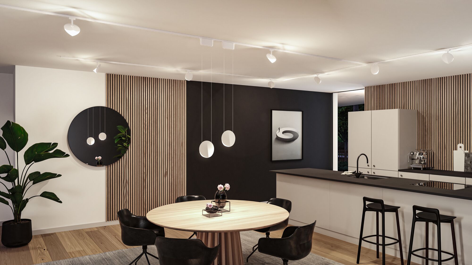 Moderne Wohnküche mit runder Holz-Tischplatte, schwarzen Stühlen und weißen Pendelleuchten an der Decke