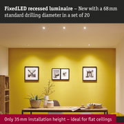 Living room with yellow wall and five white fixed LED recessed lights in ceiling for modern lighting