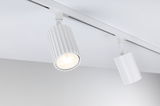 White aluminium LED spotlight with ribbed design on track system for modern interior lighting