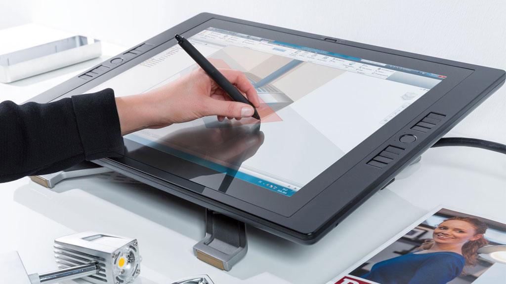 Hand drawing on black graphic tablet with pen, modern design and lighting planning tool.