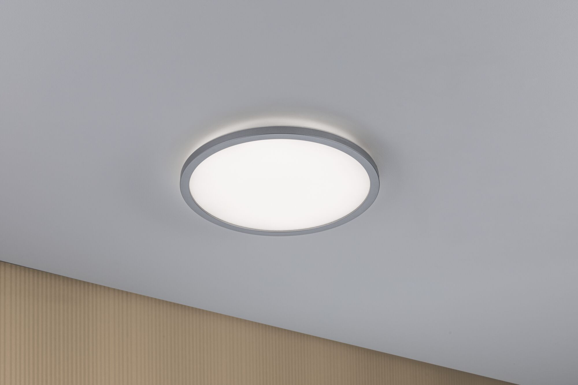 Round LED ceiling light with grey metal frame and warm white light for modern interiors
