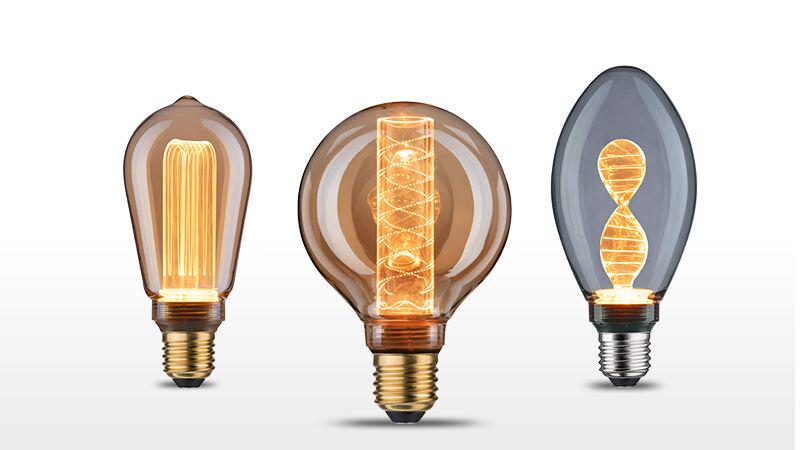 Drie decoratieve LED-lampen met warm licht en modern ontwerp in bruin en grijs glas.