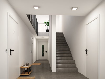 Modern hallway with grey floor, white doors and two square metal and plastic ceiling lights