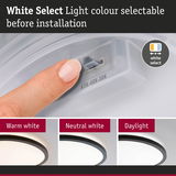 Finger adjusting light colour on white LED ceiling light with selectable warm, neutral, and daylight options