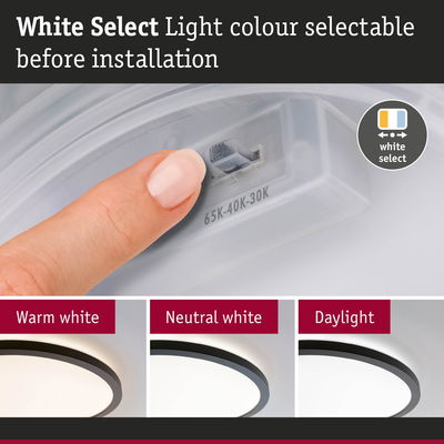 Finger adjusting light colour on white LED ceiling light with selectable warm, neutral, and daylight options