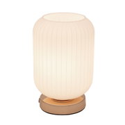 Round table lamp with ribbed white glass and gold metal base for elegant home lighting