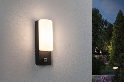 Modern outdoor wall light with black metal frame and white glass, perfect for garden lighting.