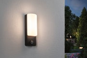 Modern black outdoor wall light with white glass and motion sensor for garden lighting