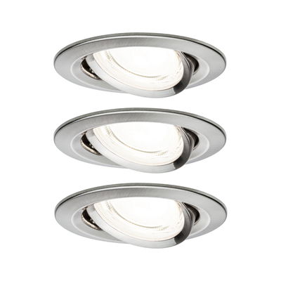 Three round recessed spotlights in brushed stainless steel with adjustable heads for versatile lighting