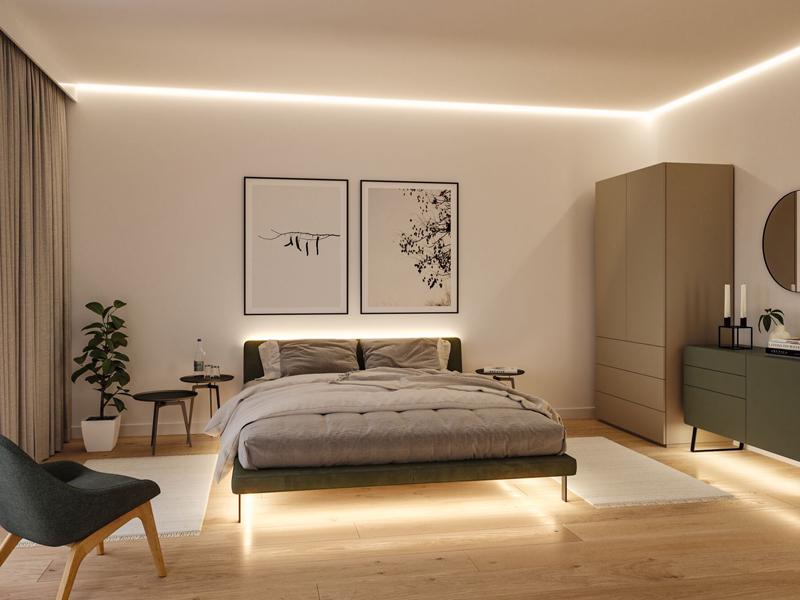 Modern bedroom with LED strip lighting on ceiling and under bed creating ambient lighting effect.