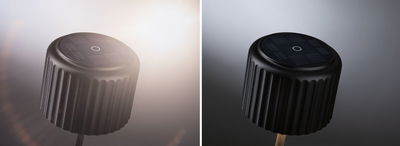 Black ribbed solar garden spotlight with round solar panel and stake for outdoor lighting