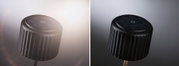 Black ribbed solar garden spotlight with round solar panel and stake for outdoor lighting