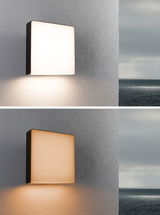 Square outdoor wall light in black metal with white and warm white illumination for terrace.