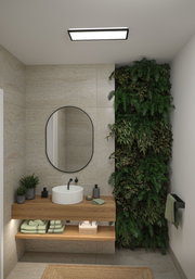 Salle de bain moderne avec meuble en bois, miroir rond et mur végétal vert pour une ambiance naturelle