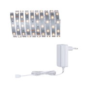 Flexible LED strip with warm white lights and white power adapter for versatile lighting solutions.