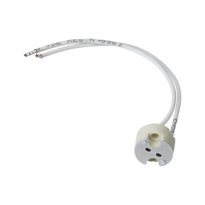 White ceramic socket adapter with two wires for LED lamp installation and lighting technology