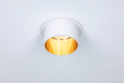 Round white metal recessed spotlight with warm white light for modern indoor lighting