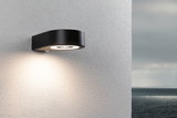 Schwarze LED-Außenwandleuchte aus Metall mit rundem Design und warmweißem Licht für Hausfassaden.