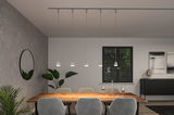 Modern white metal pendant lights above wooden dining table with grey chairs and plants