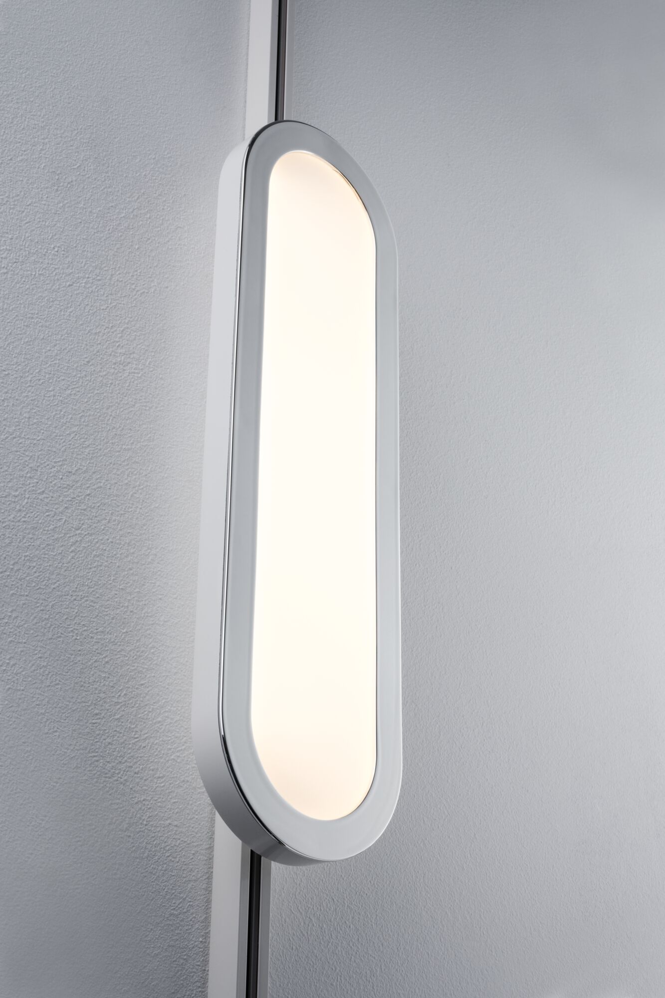 Modern white oval LED wall light with warm white illumination for stylish home lighting
