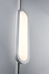 Modern white oval LED wall light with warm white illumination for stylish home lighting