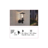Black metal outdoor wall light with motion sensor and glass cylinder for garden and terrace lighting.