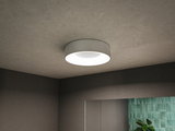 Round white metal ceiling light with diffused surface for modern home lighting