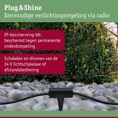 Zwart Plug & Shine besturingsapparaat op stenen met groene achtergrond, IP68 waterdichte buitenverlichting
