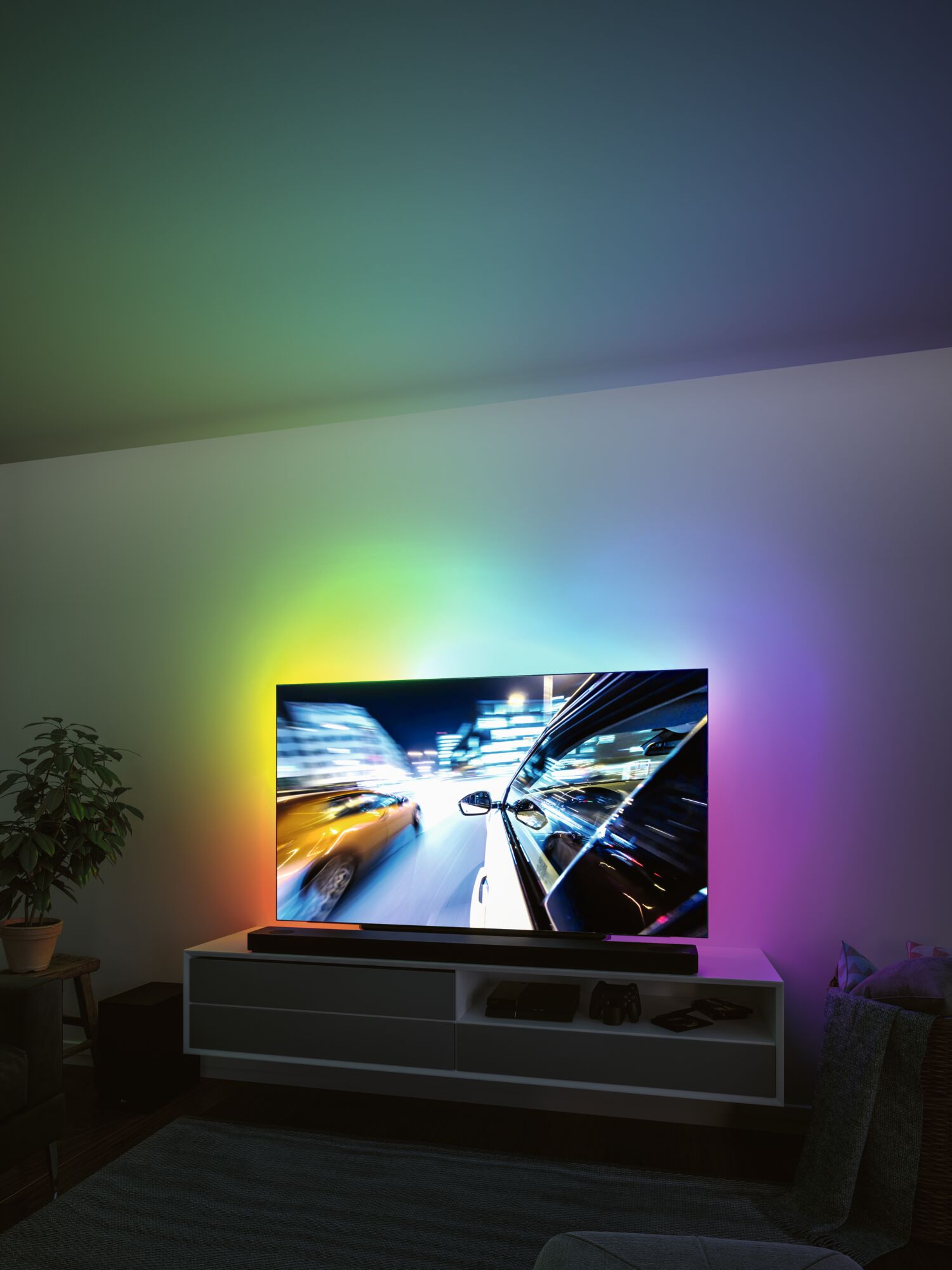 Colorful LED backlighting behind TV creating ambient lighting for immersive viewing experience