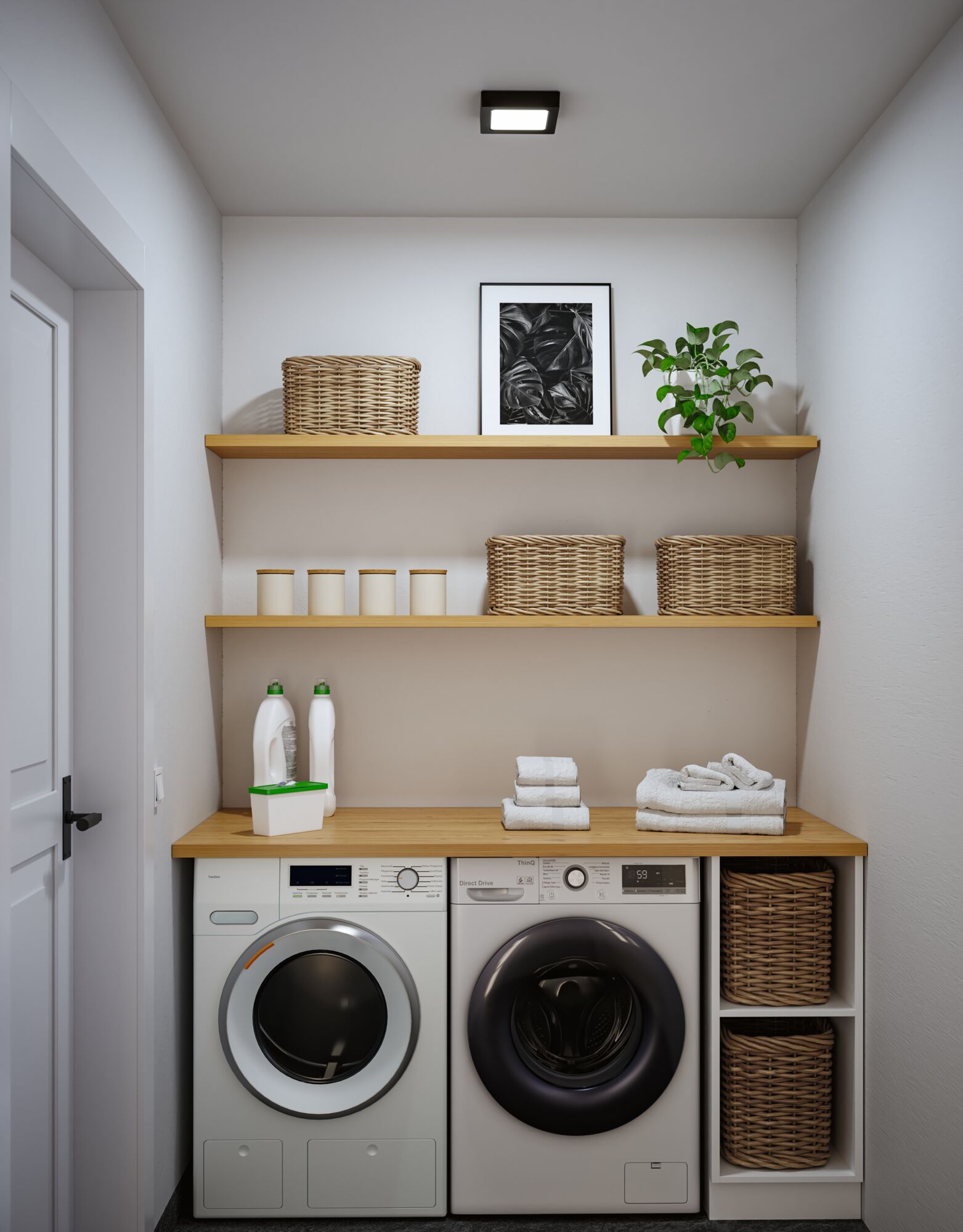 Moderne weiße Waschmaschine und Trockner mit Holzarbeitsplatte und geflochtenen Körben in heller Waschküche