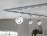 Modern white LED ceiling track with three adjustable metal spotlights for living room lighting