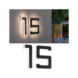 Modern house number 15 in black material with LED backlight for outdoor use.