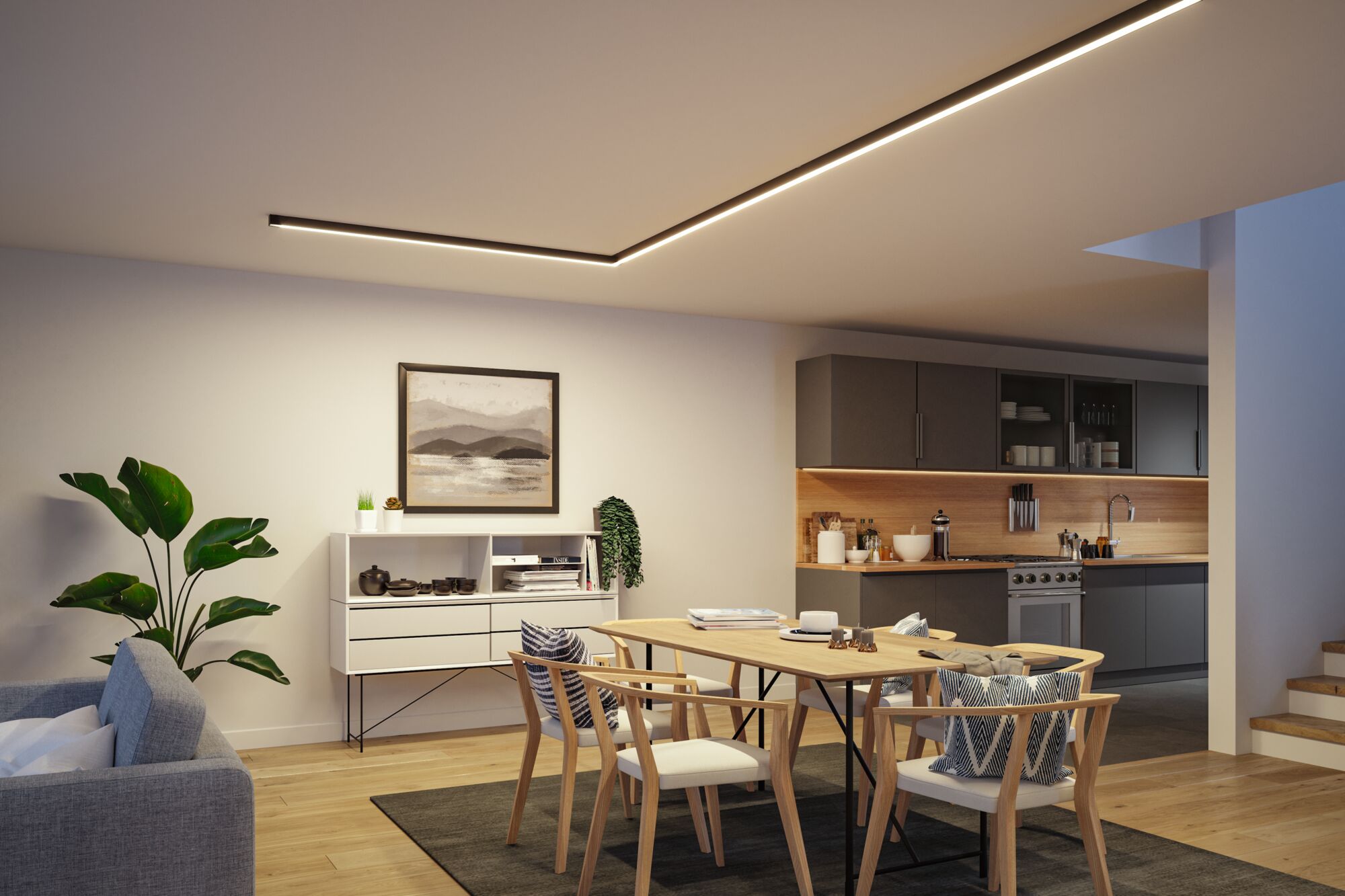 Modern dining room with wooden chairs, table and warm white indirect LED ceiling lighting.
