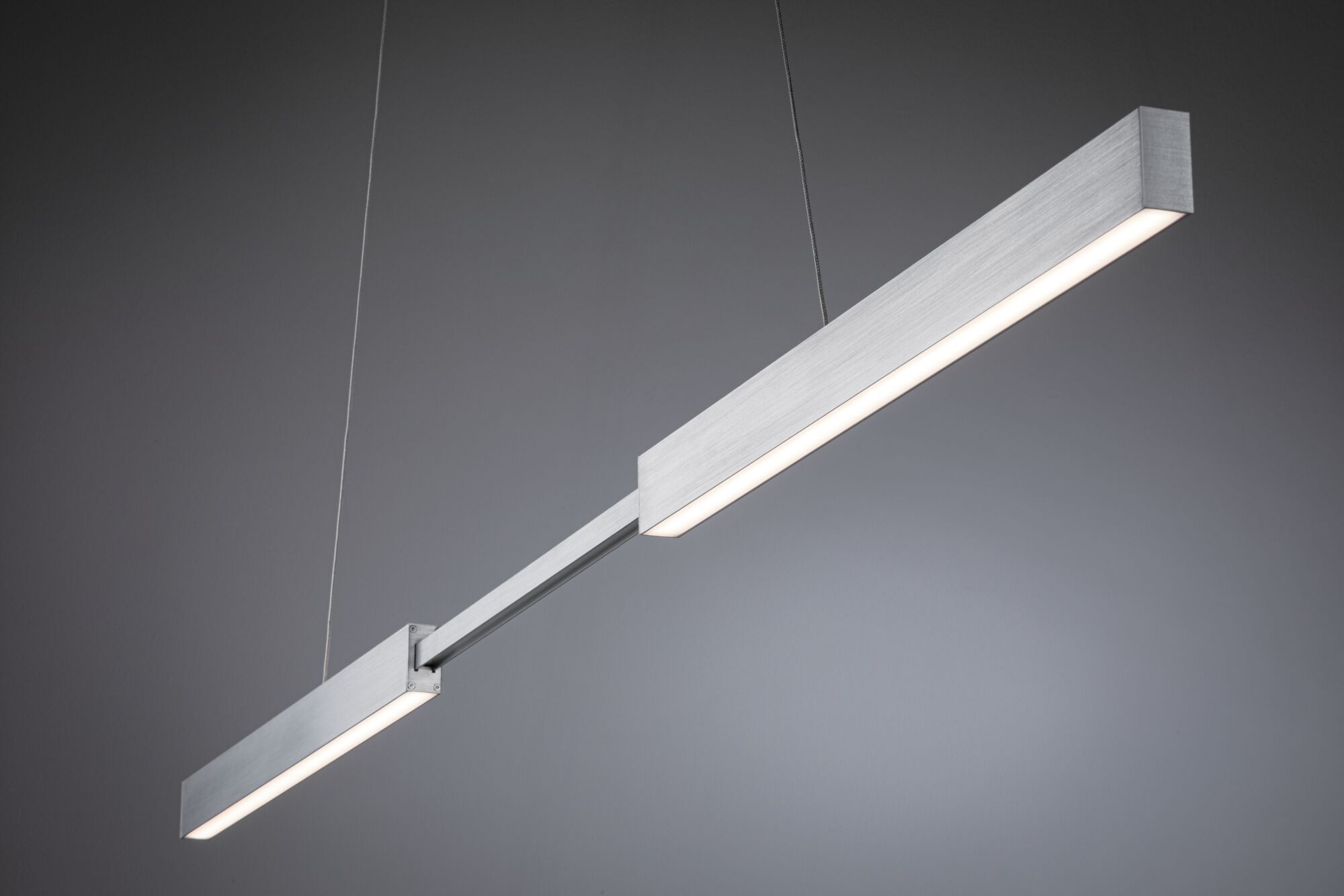 Modern LED pendant light in brushed silver aluminum with warm white light for living spaces