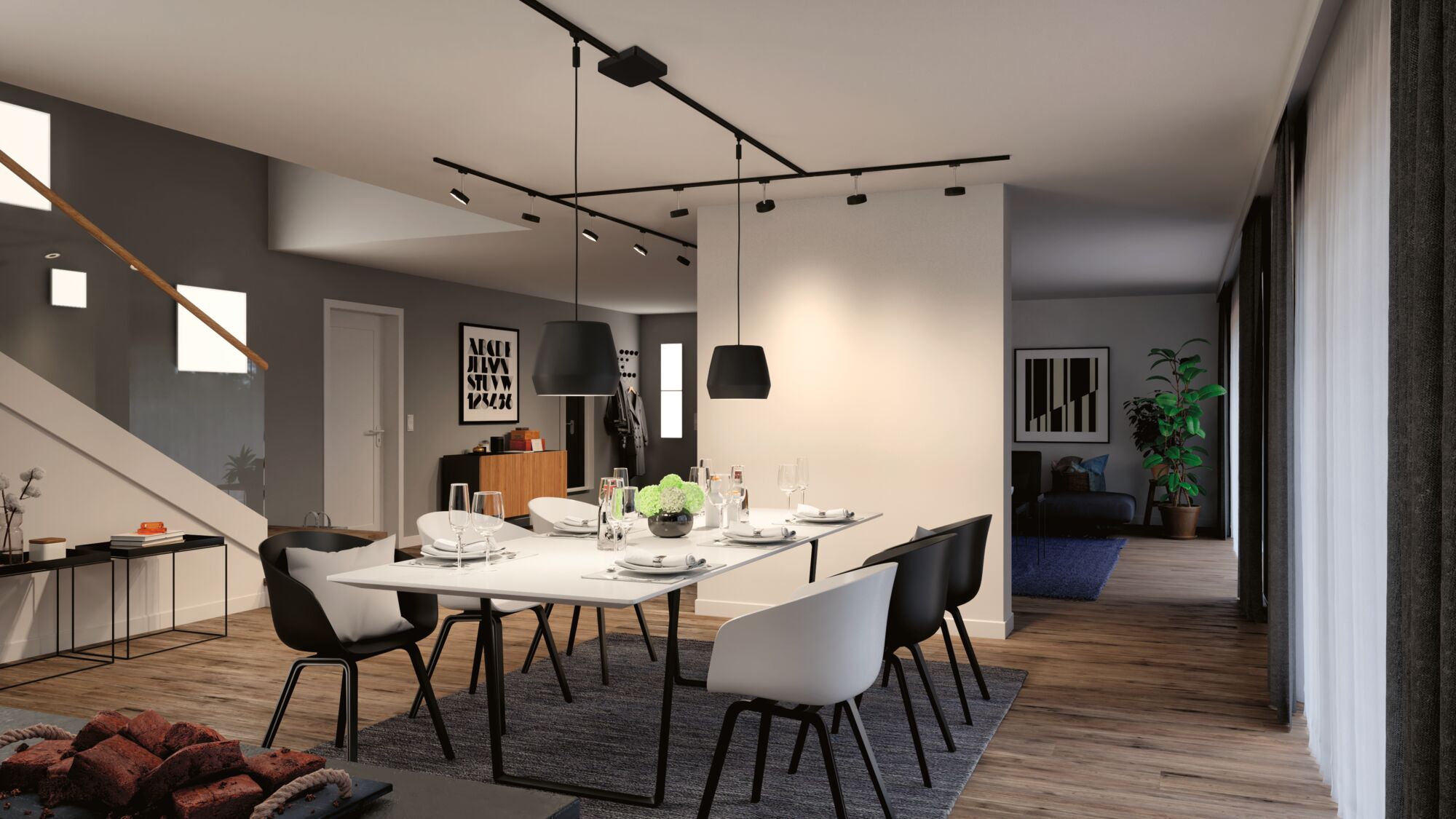 Moderne eetkamer met zwarte en witte stoelen, zwarte hanglampen en houten vloer met verlichting