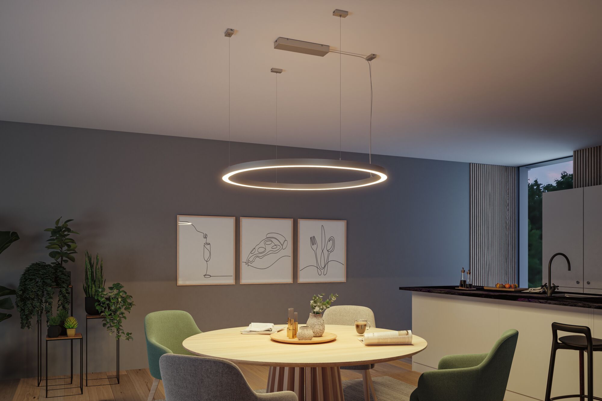 Modern round LED pendant light in warm white above wooden dining table with green chairs
