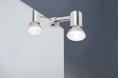 Modern LED wall spotlight in brushed aluminum with two adjustable lamp heads for targeted lighting