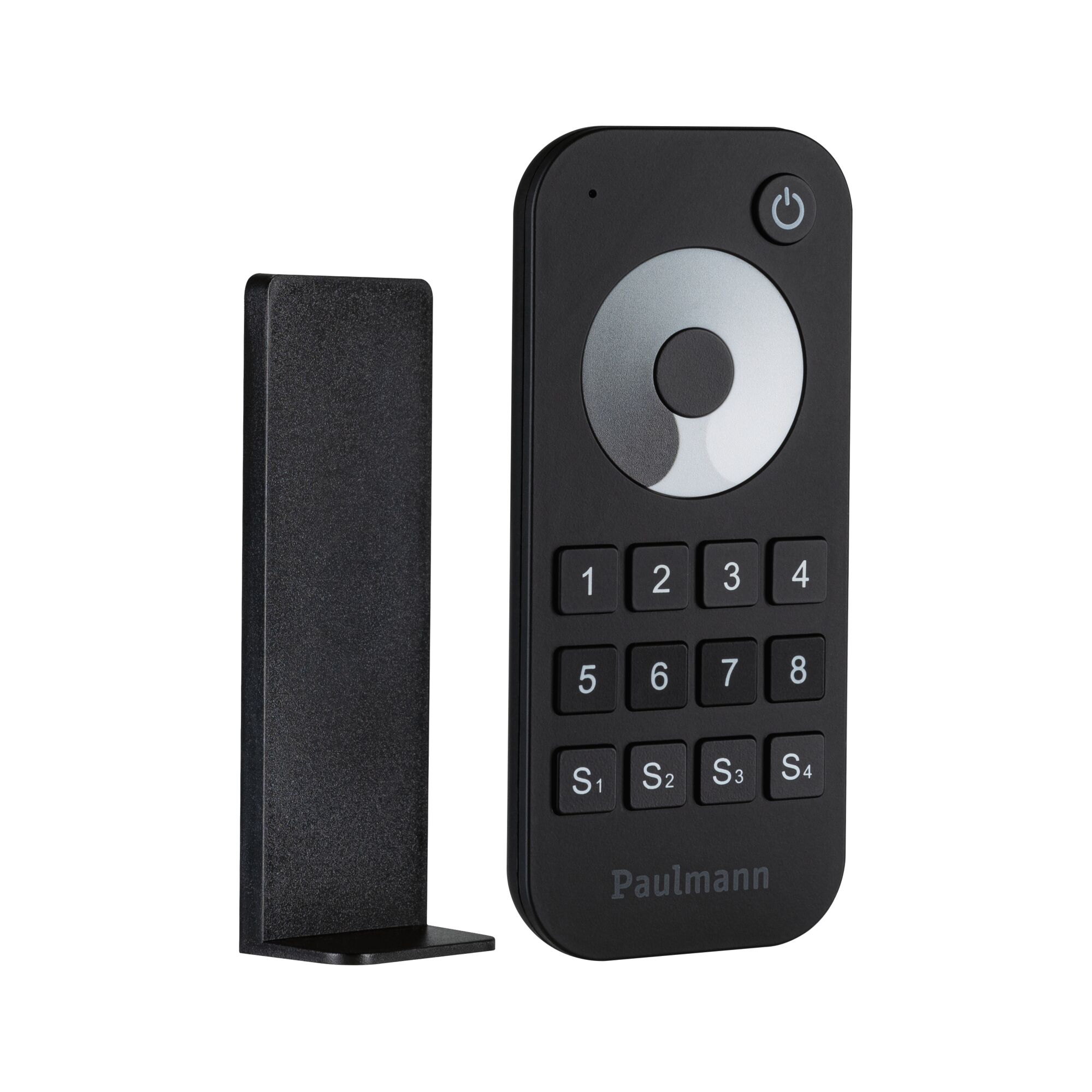 Black plastic remote control with buttons and holder for indoor lighting control